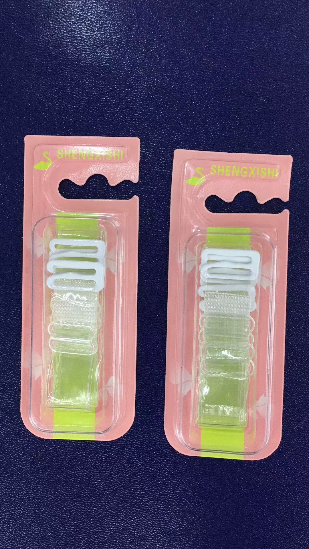 Transparent straps used with various outfits including a white dress and black tank top