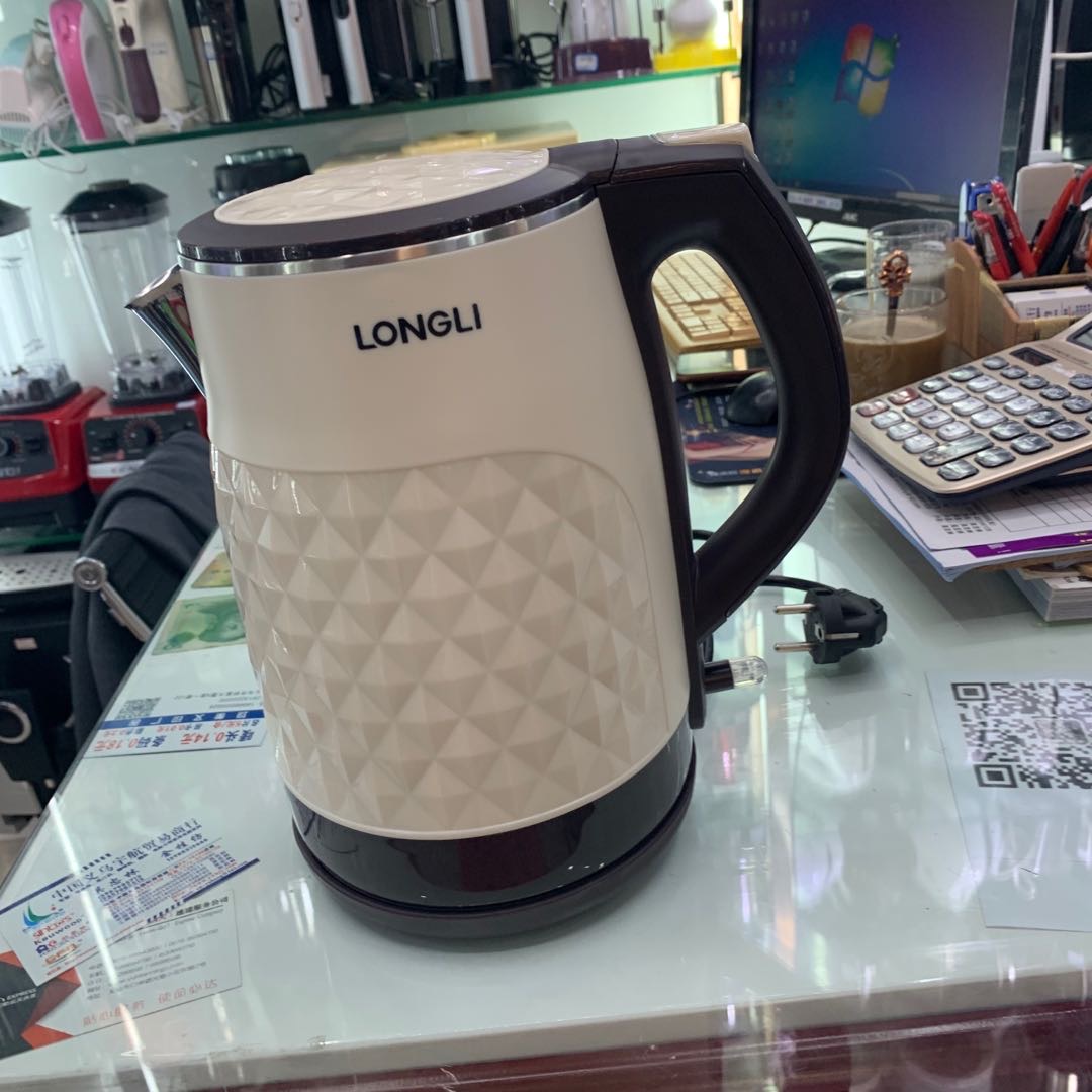 White and brown textured kettle for household use