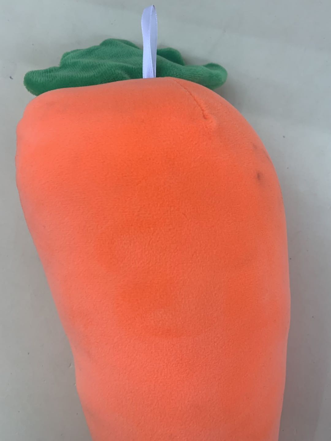 A plush toy with smiling faces and carrots bouncing around on all sides is a home decoration for children and girls details Picture