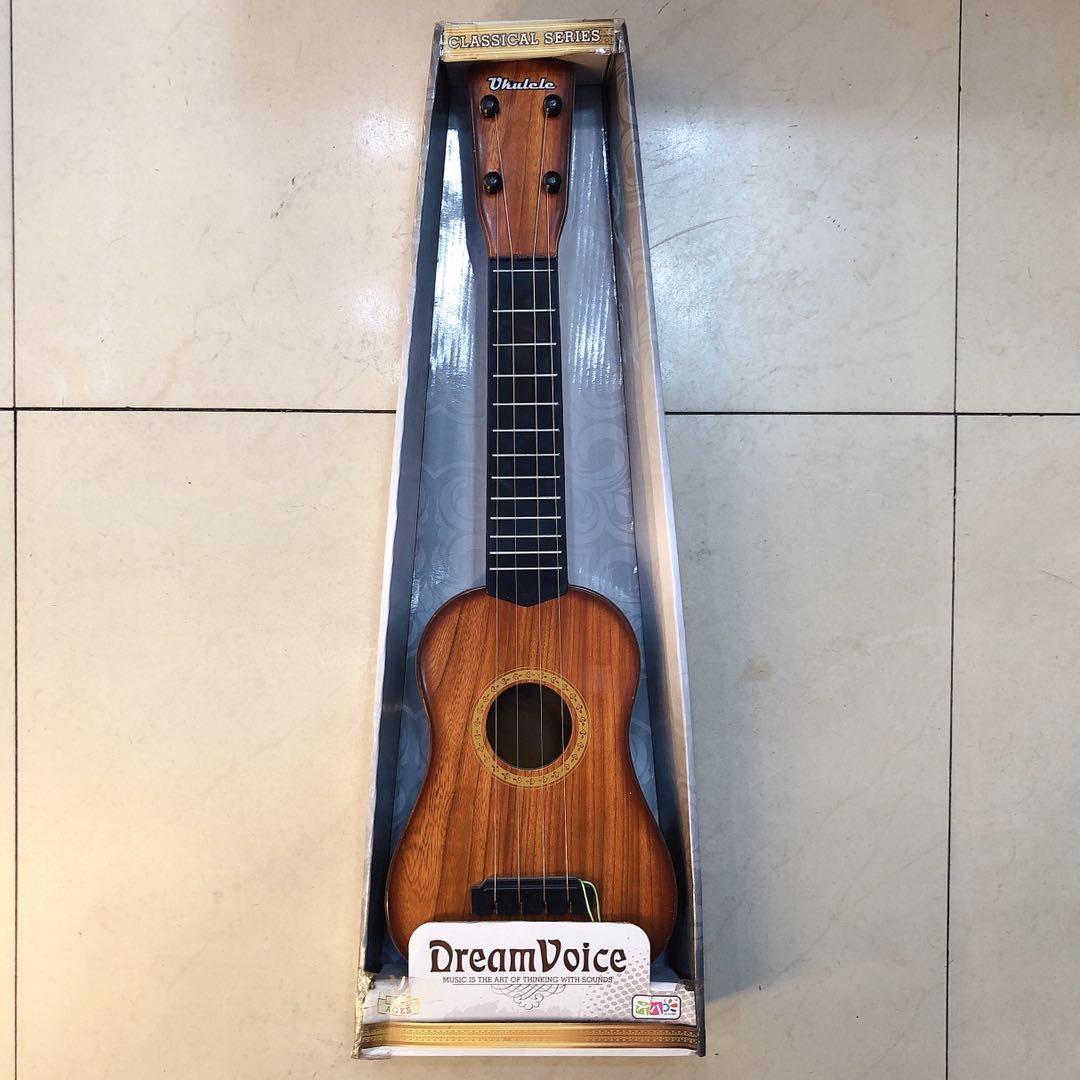 Simulated children's four-string small guitar toys, educational and educational Musical Instruments available for wholesale from manufacturers
