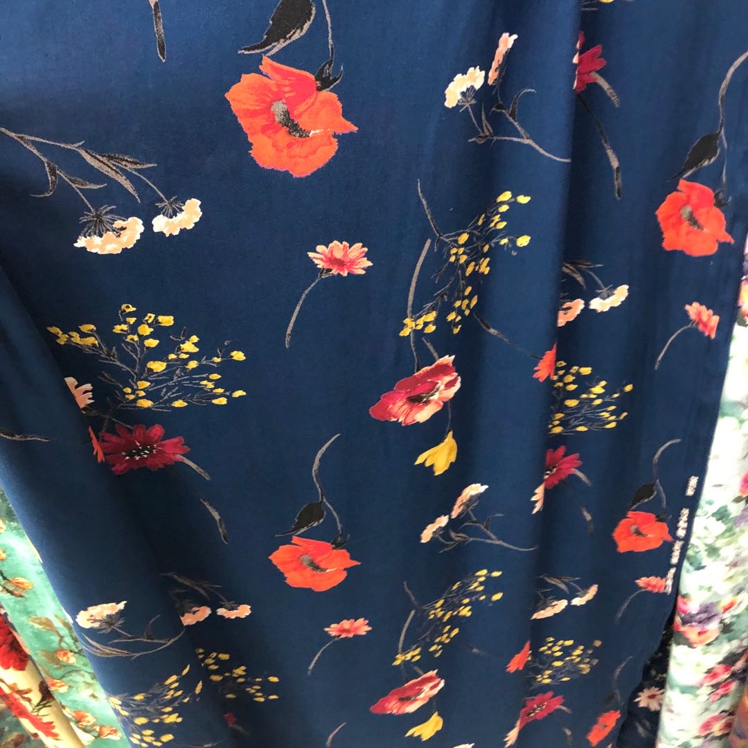 Silk cotton fabric, silk cotton fabric for spring and summer clothing, blue background with flowers details Picture