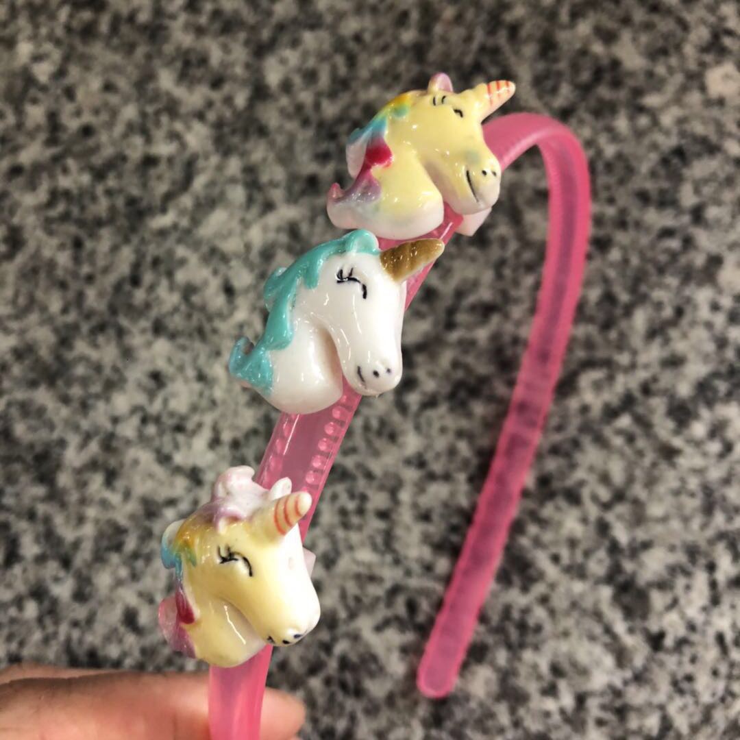 Girl Wearing Unicorn Headband Playing