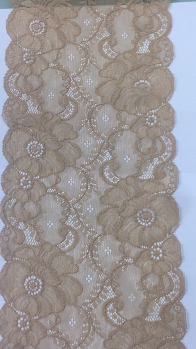 Close-up of detailed Fujian lace used in high-end fashion