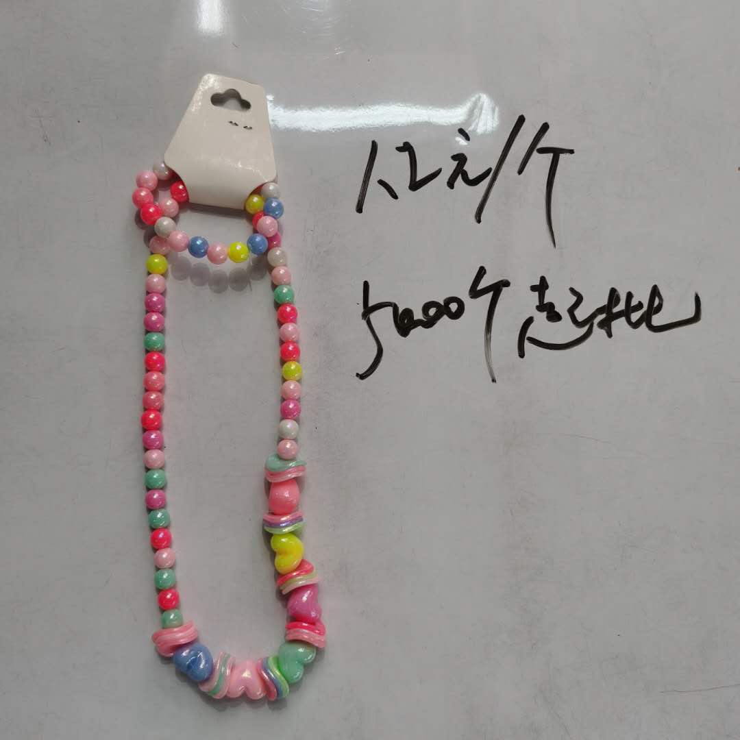 A trendy and versatile children's accessory - a colorful bead necklace for little girls