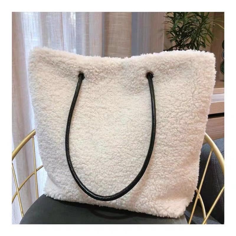 Side view of Japanese-style faux fur handbag with satin ribbon detail