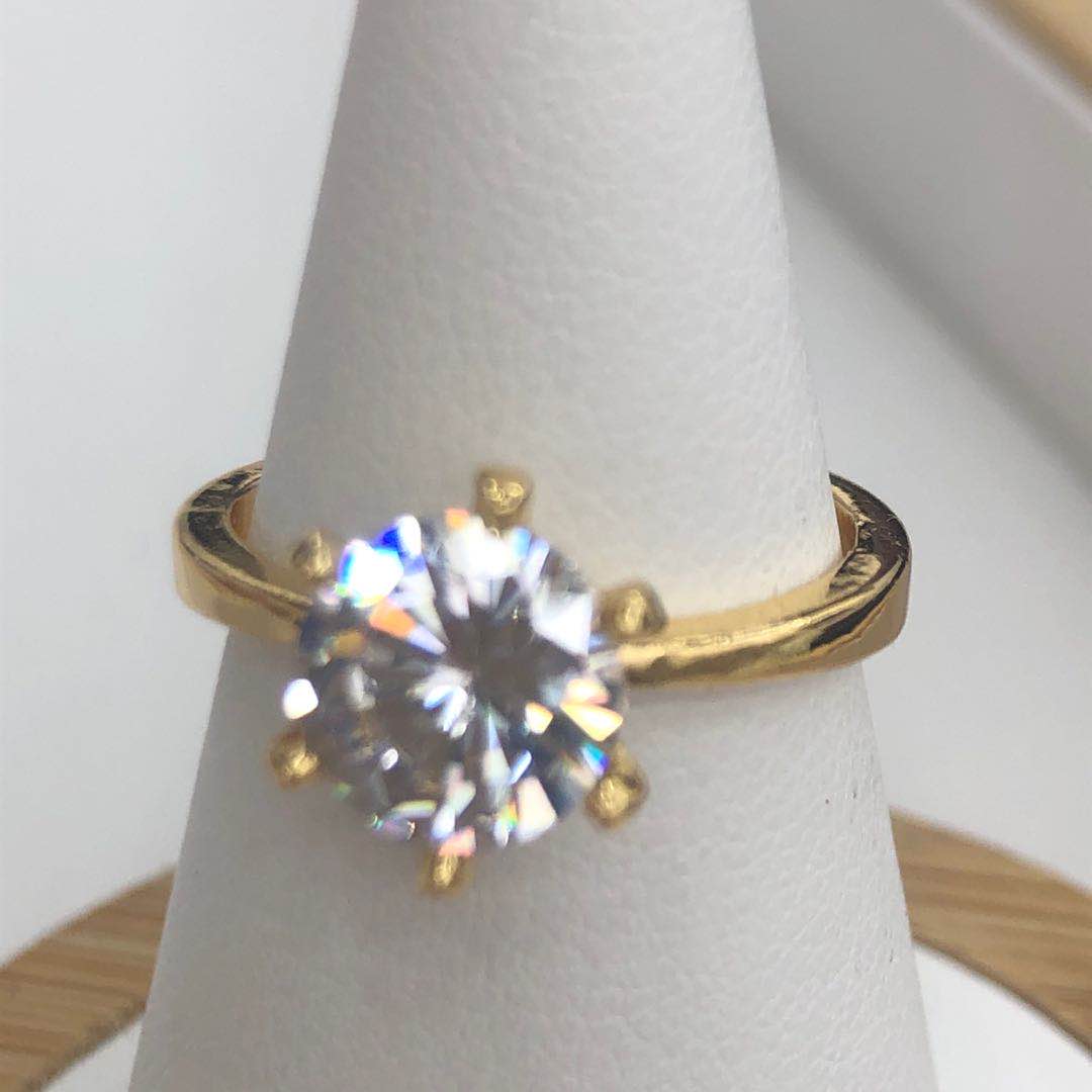 Close-up of gold zircon ring showing fine craftsmanship and sparkle