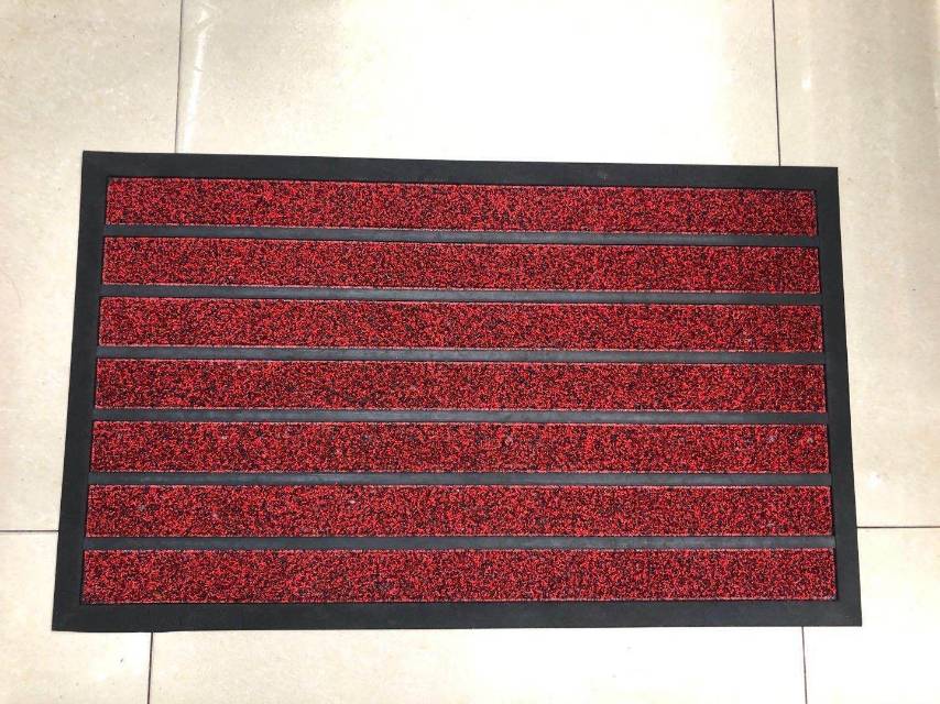 Photo showing color and texture details of outdoor striped pattern doormat