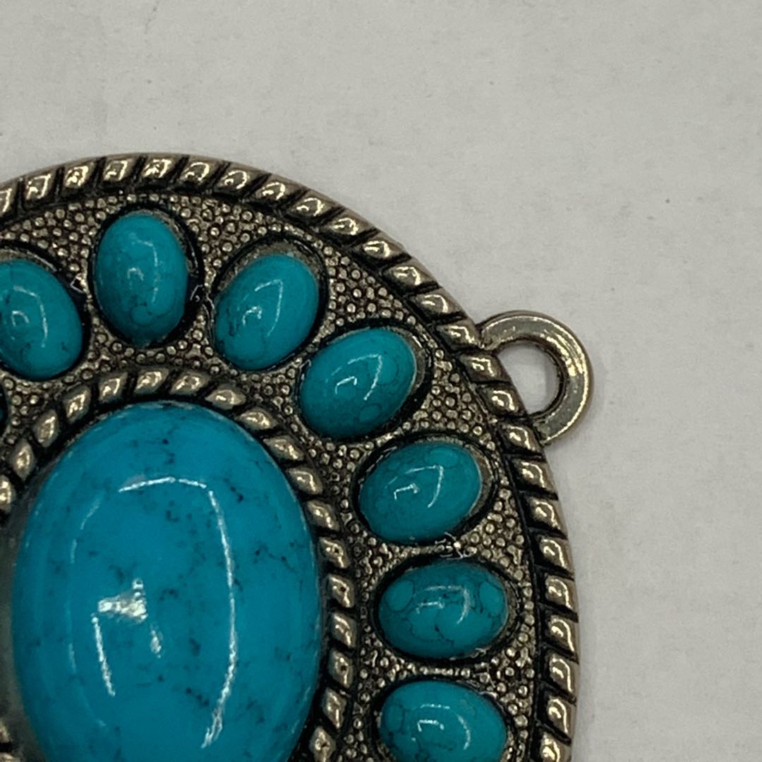 Woman styling a retro belt buckle on a dress