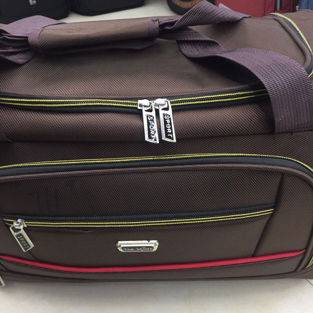 Man using anti-theft backpack at airport with laptop and charging cable
