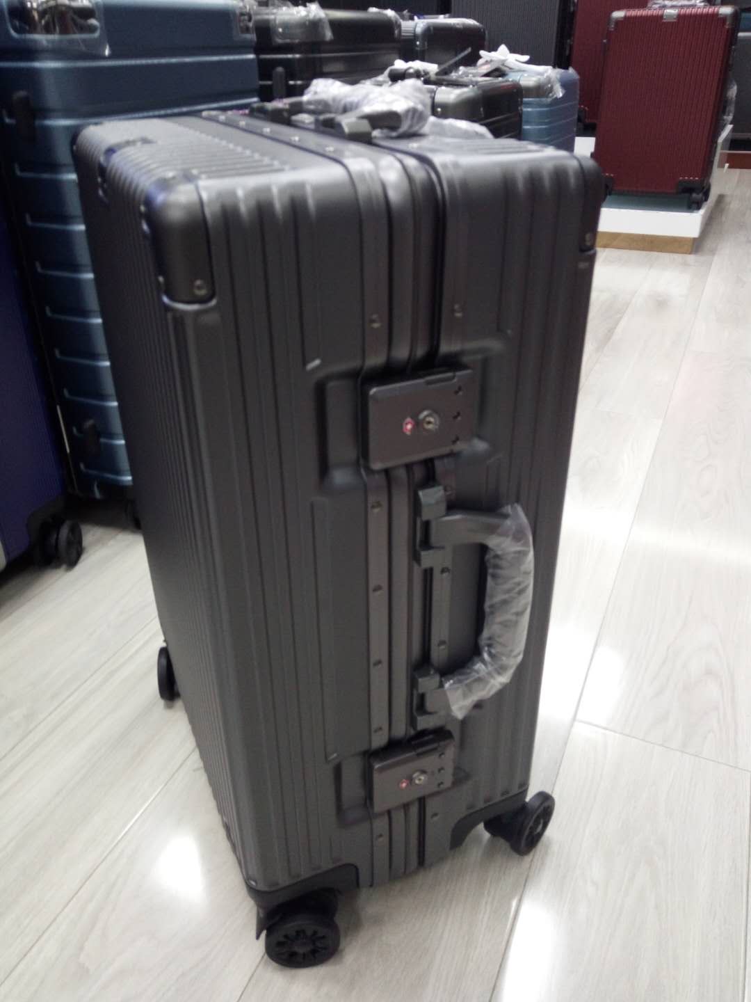 Paul's 20-inch multi-color suitcases for both men and women are available for boarding details Picture