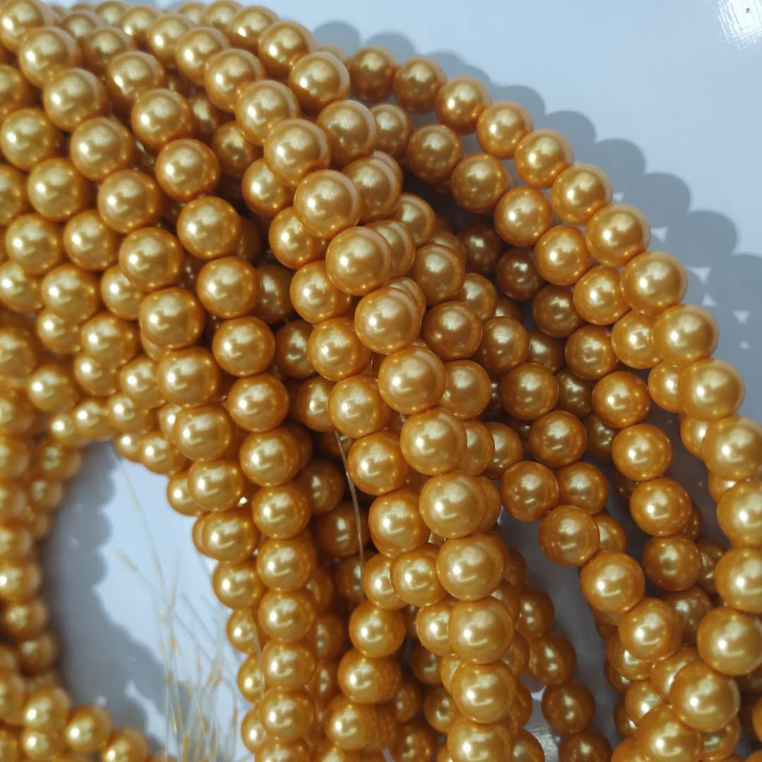 Golden imitation glass pearl bracelet with beads, DIY handcrafted creative accessory and craft jewelry details Picture