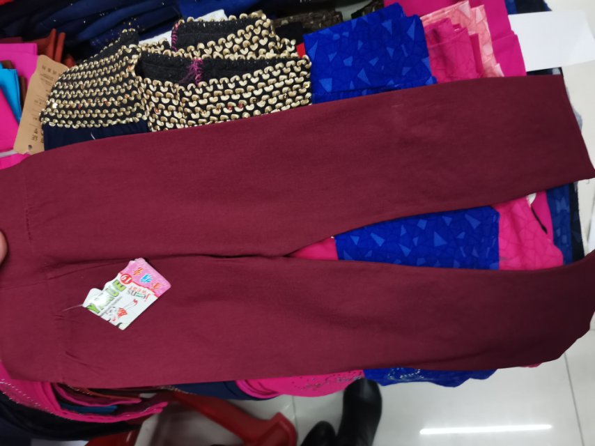 A deep red, diamond-encrusted cotton children's dress with leggings on top Specification image