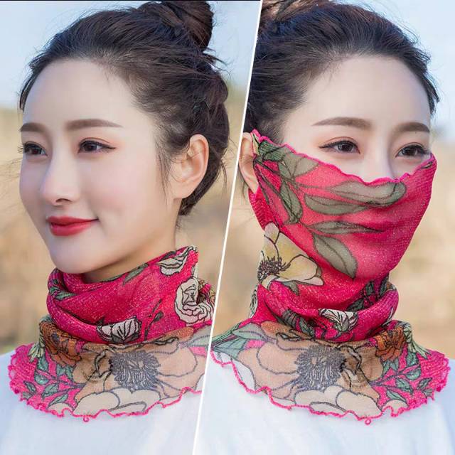 Close-up of silk neck wrap styled as a face veil and hanging ear cover
