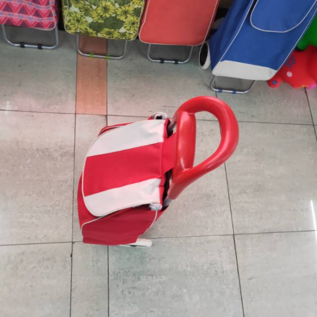Folded lightweight trailer stored in car trunk