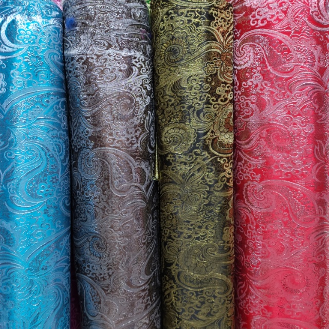 Silver-threaded brocade fabric for clothing decoration is available in multiple colors and the price is negotiable