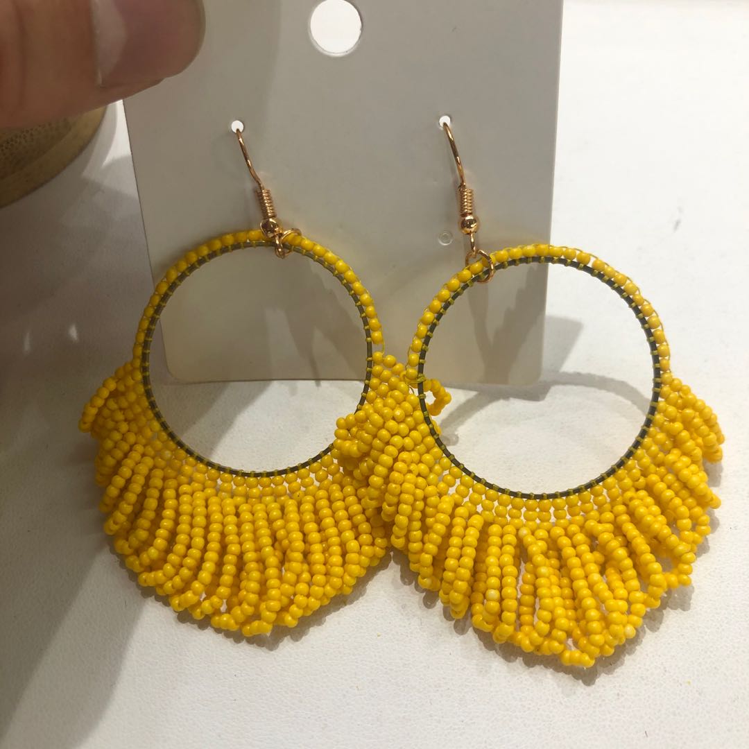 New stylish earrings with a hollow ring design and tassel from Japan and South Korea, a versatile and trendy accessory