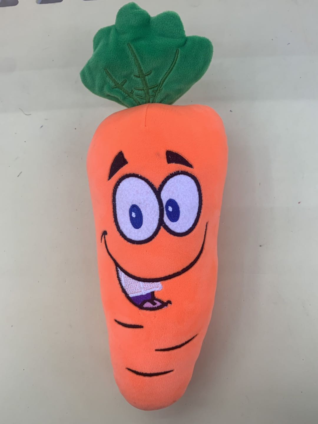 A plush toy with smiling faces and carrots bouncing around on all sides is a home decoration for children and girls