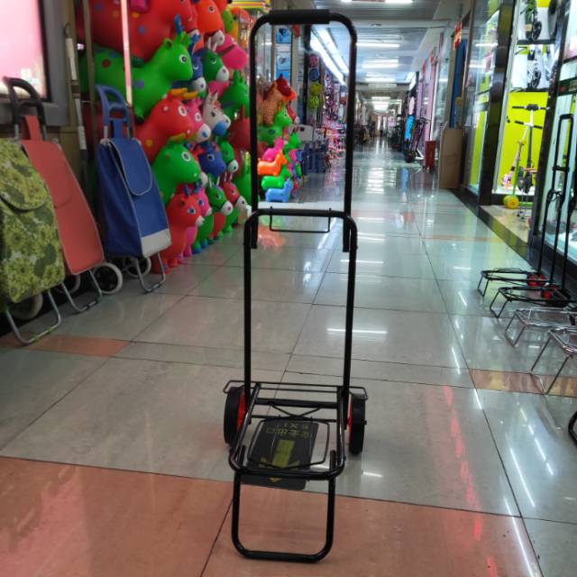 A lightweight suitcase, a portable storage tool, and a trolley for dragging things