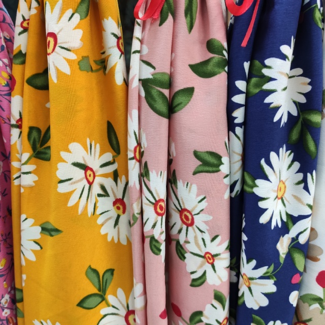 The printed four-sided elastic clothing decorative fabric is available in multiple colors and the price is negotiable