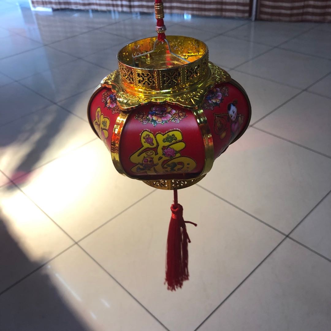 During the Spring Festival, children carry lanterns to celebrate the New Year. These are toys for babies to play with, featuring luminous night lights details Picture