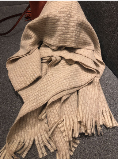 A fashionable, trendy, versatile and warm fringed sequined knitted scarf for women