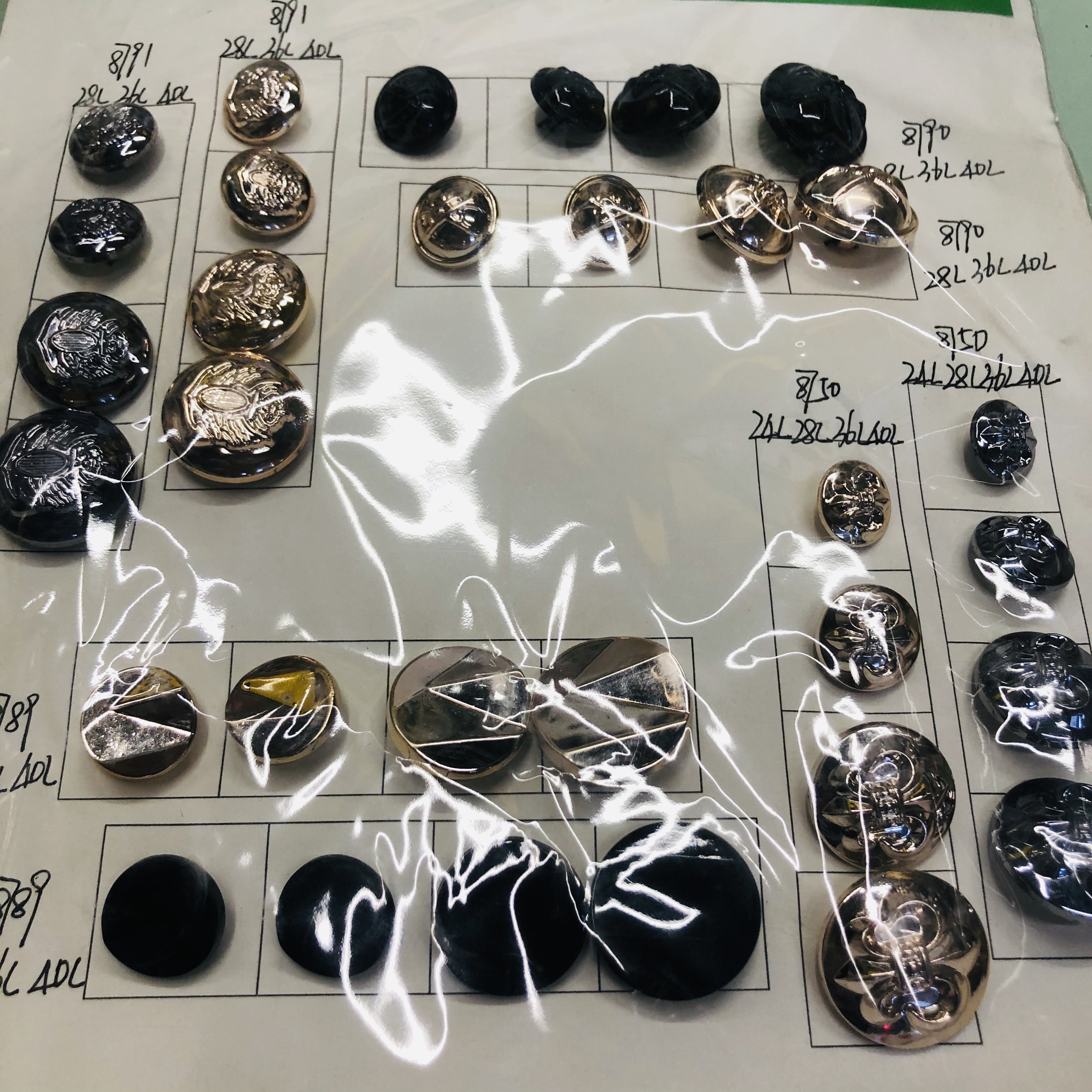 Close-up of different metal button designs