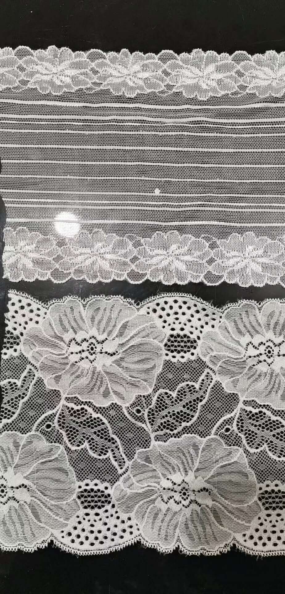 We have a wide variety of white lace fabric from Fujian in stock