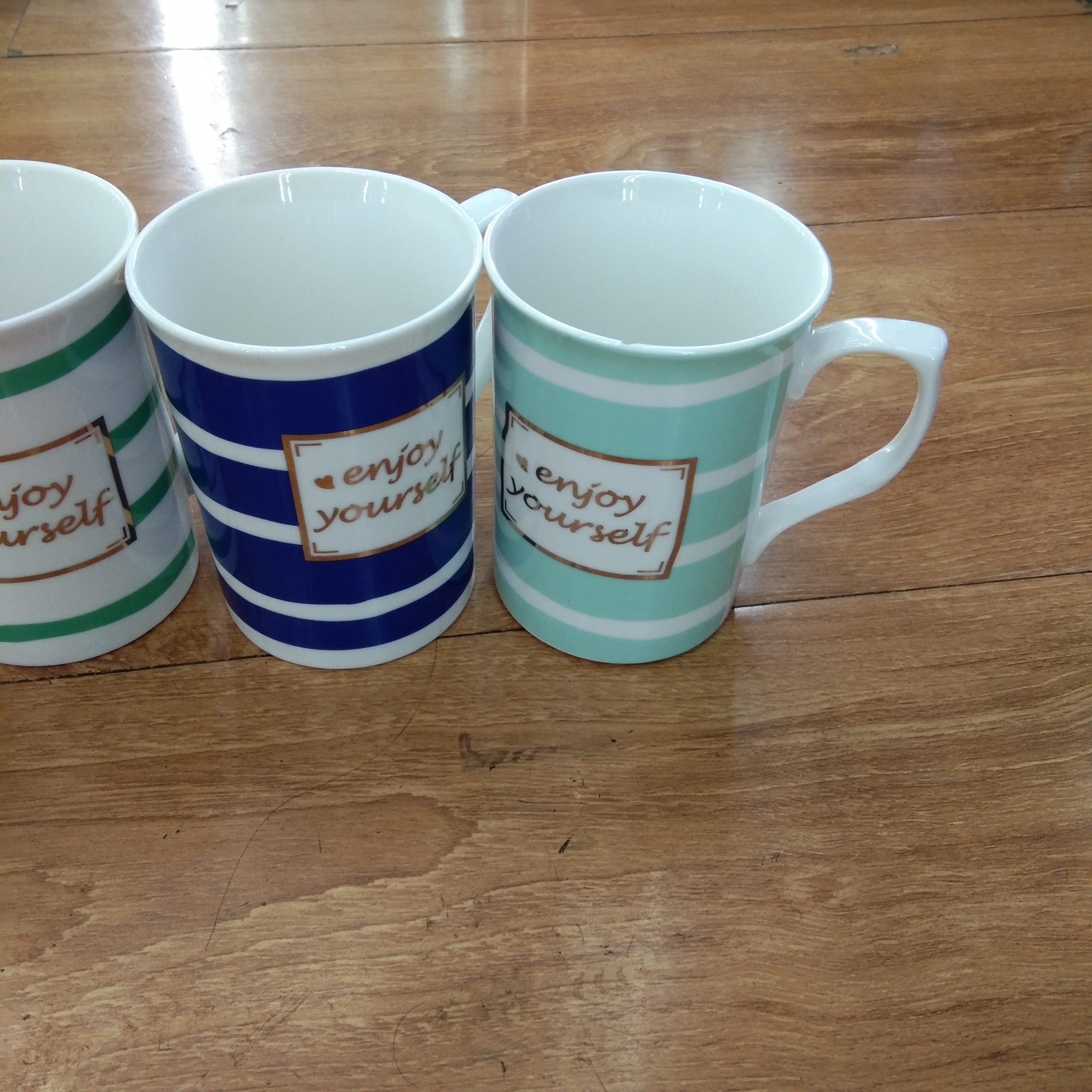 Wholesale of ceramic striped letter cups, creative mugs and various household cups details Picture