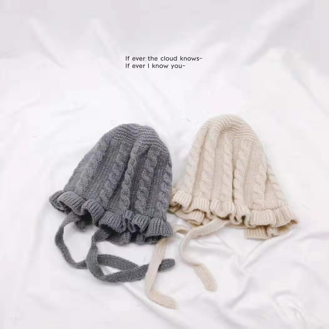 A fresh and simple lace tie solid-color children's knitted hat, warm and cute baby ear-protecting hat, woolen hat for autumn and winter Specification image