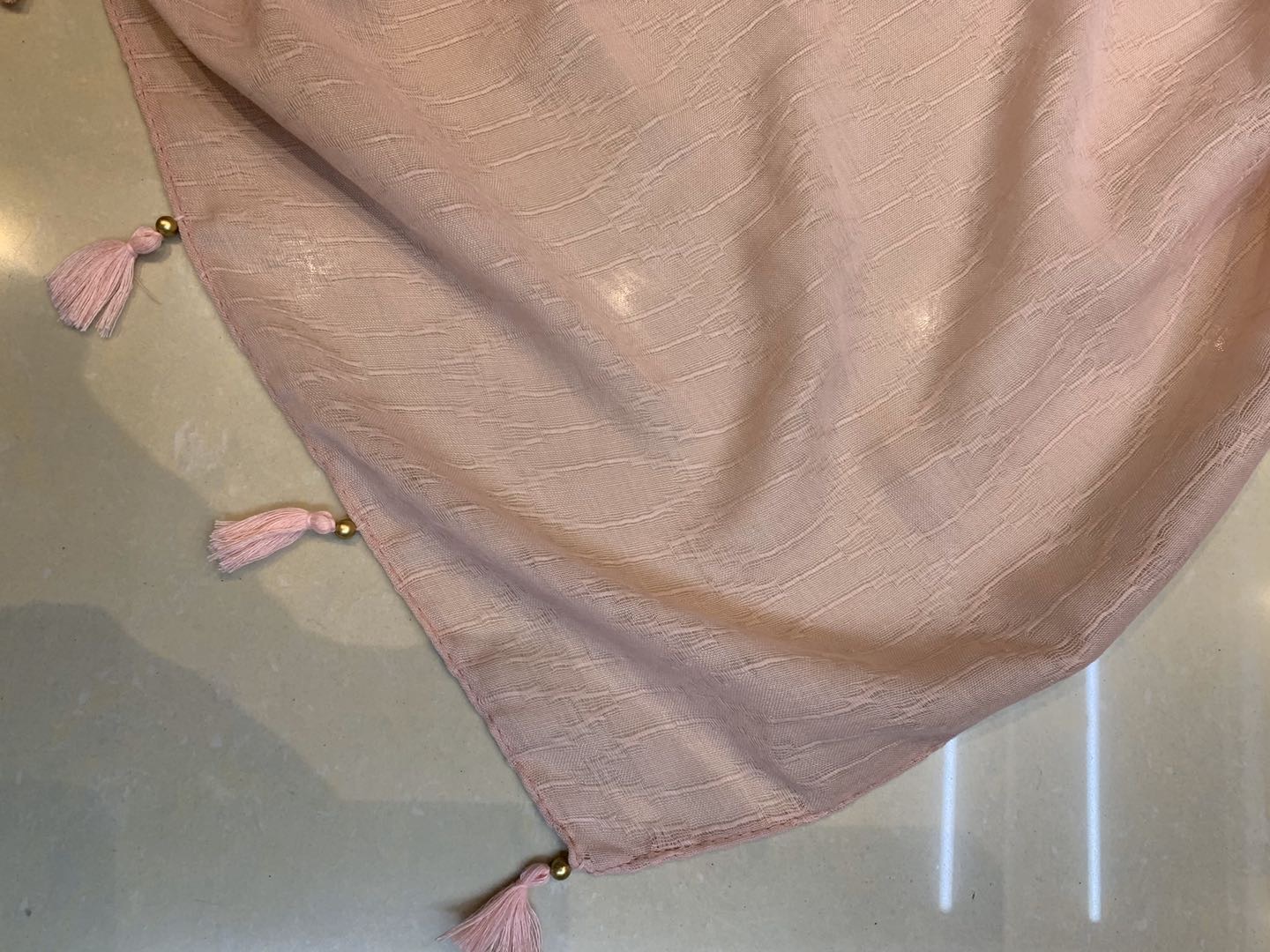Ladies' scarves are fashionable, versatile, and trendy bestsellers. They feature wavy cut flowers, small pendants, and golden beads details Picture