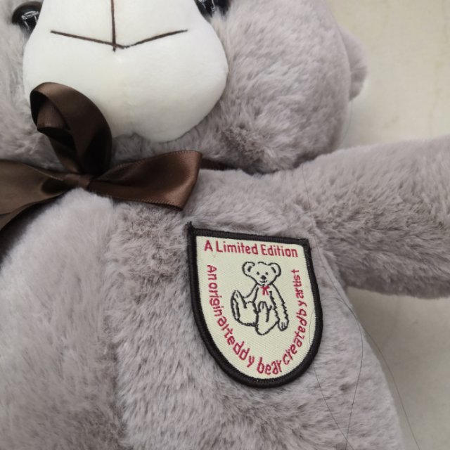 Realistic and cute plush toy bear doll, grey glass ball plush toy details Picture