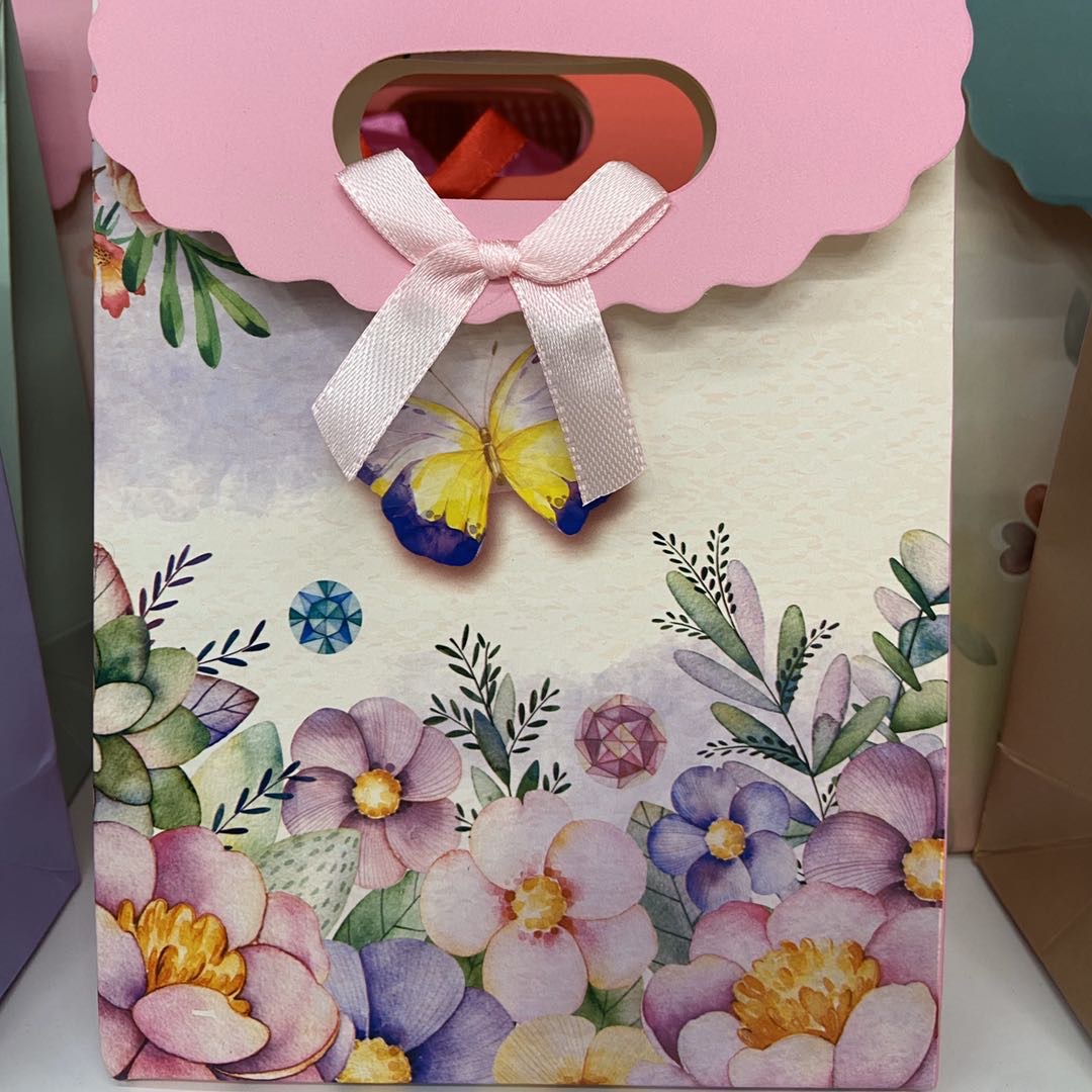 服装饰品包装袋卡通翻盖手提礼品袋纸袋年扣里带手提袋可定做