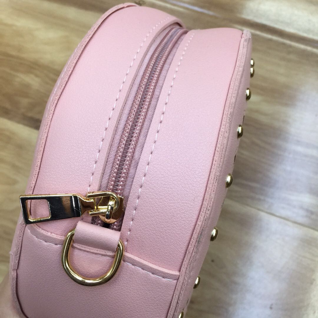 Hollowed-out rivets, pure handcrafted cowhide carvings, Tang grass hand-held small round bag, women's crossbody single-shoulder bag, trendy Specification image