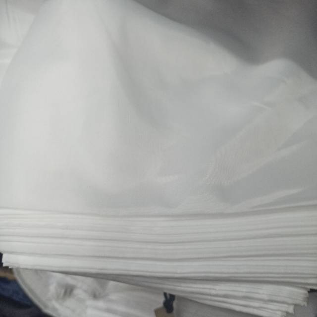 Polyester taeff light white fabric is used for wholesale and retail of clothing, handicrafts and other fabrics. Quality and quantity guaranteed, available in stock. For orders, please consult