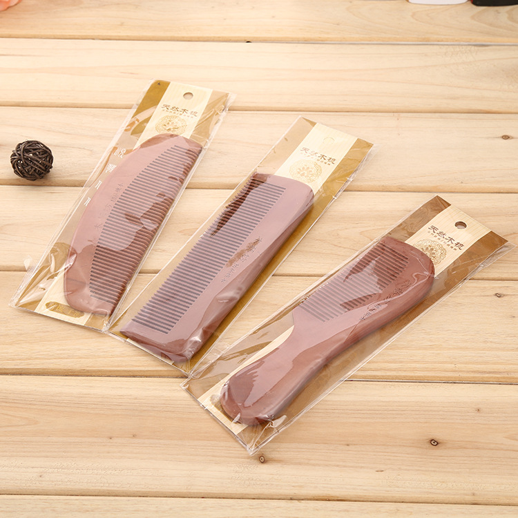 Three optional high-end wooden combs for the pedestrian street, each with a comb band, are individually packaged and can be hung on a nail Specification image