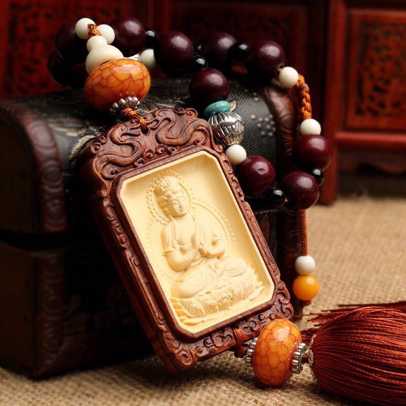 The car pendant of the car of the Buddha is made of yellow poplar. The dog amitabha, the patron saint of the Buddha, is decorated in peach wood thumbnail
