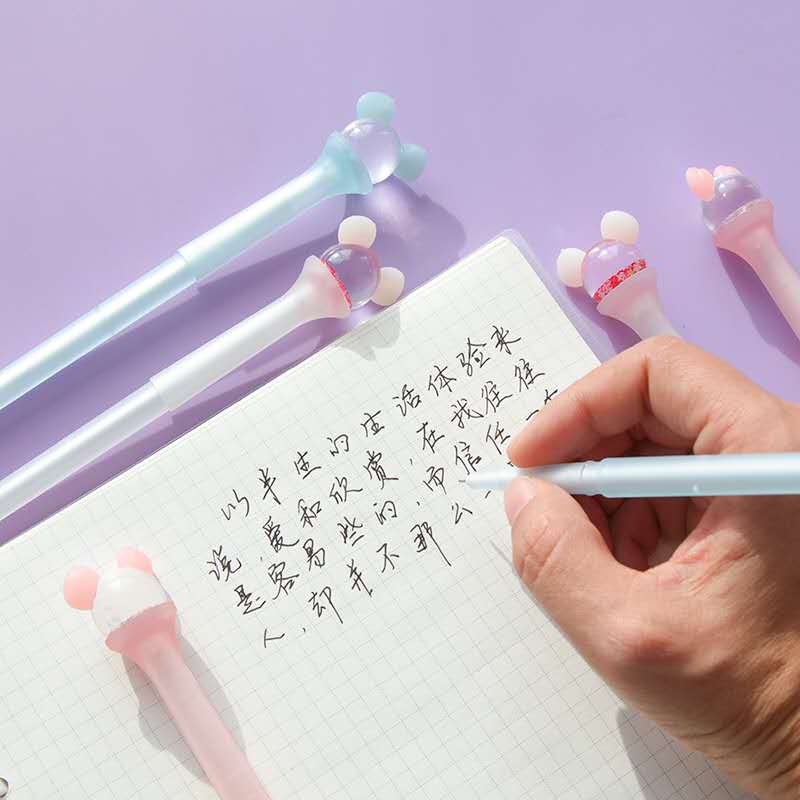 Macaron Unicorn Pens displayed with notebooks, stickers, and washi tape