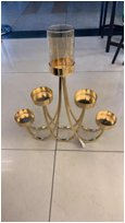 The glass ironwork golden multi-head candlestick is equipped with a glass cover for each candle dial