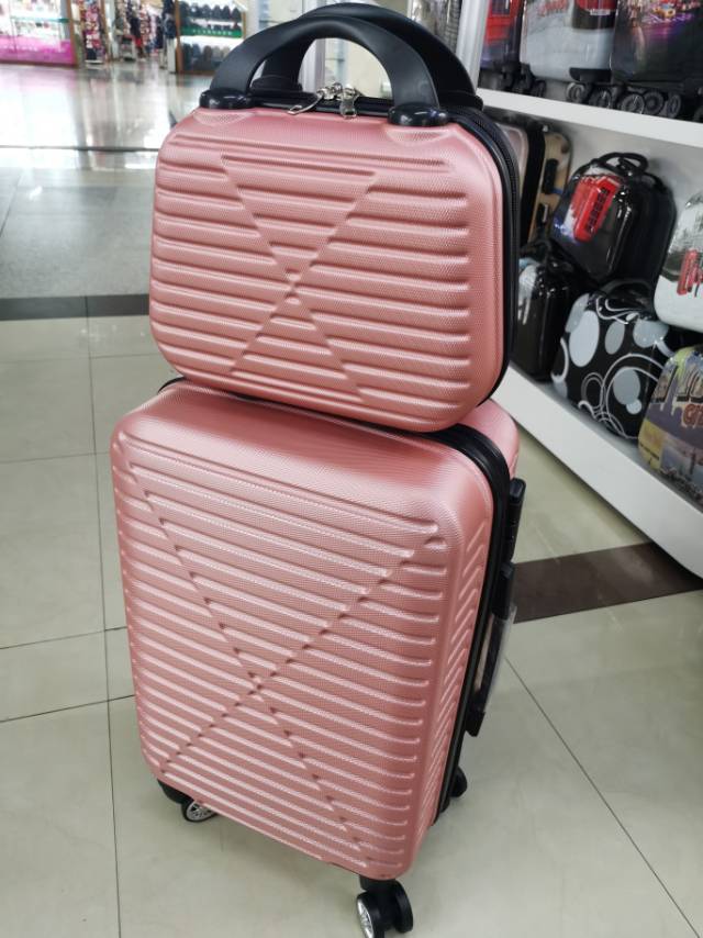 Pink matte two-piece suitcase with a handle