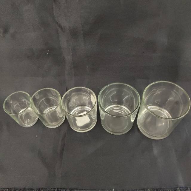 A transparent and cost-effective small cup for filling candles with a glass candlestick