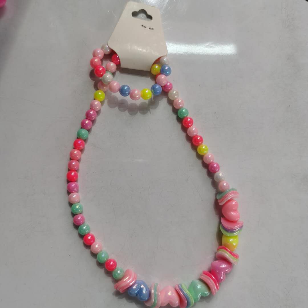 A trendy and versatile children's accessory - a colorful bead necklace for little girls details Picture