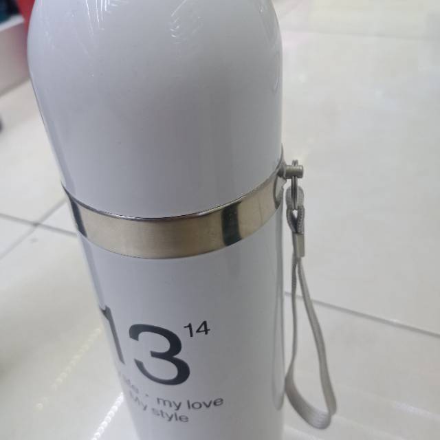 A couple keeps a thermos with them details Picture