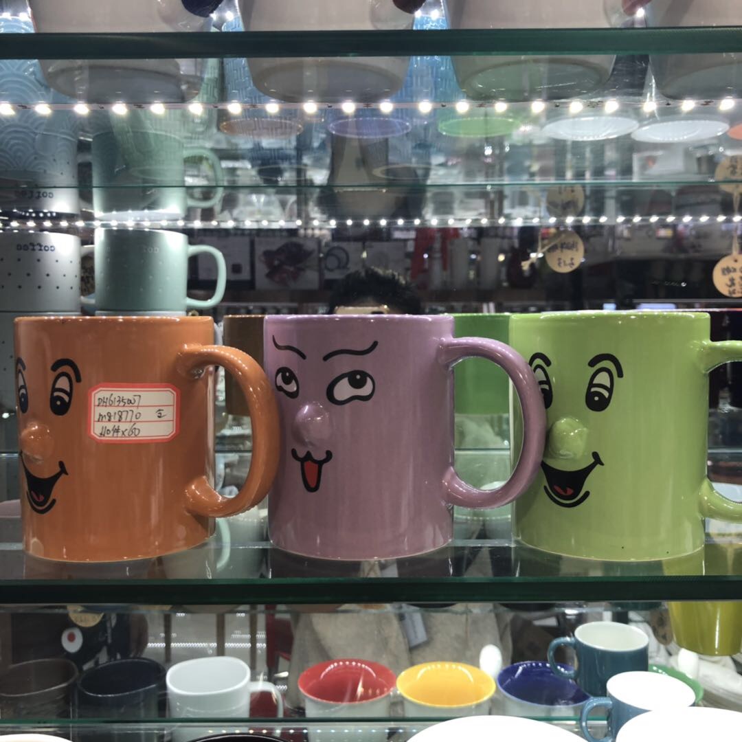 Fashionable and novel pure ceramic smiling face cup