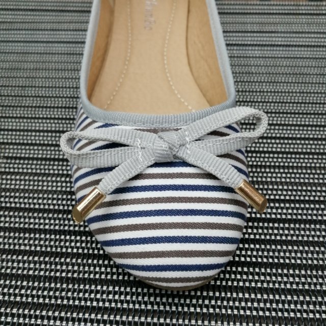 Women wearing boat shoes with jeans and dress, showcasing styling options