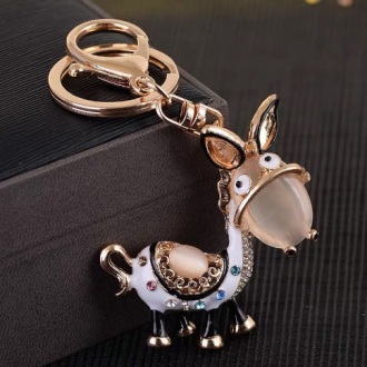 Korean creative gifts: cat's eye stone, little donkey, exquisite water diamond crystal, car key chain, women's bag pendant, key chain