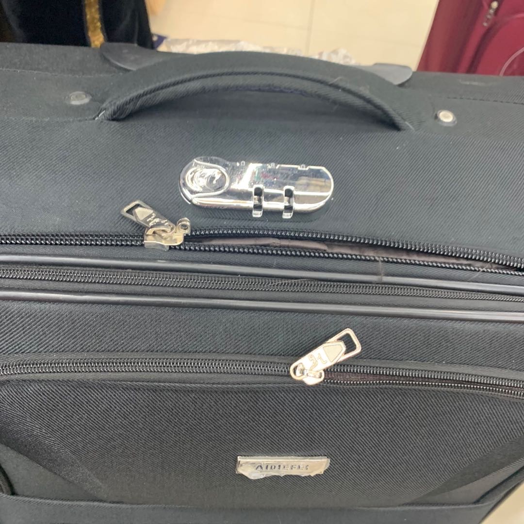 黑色牛津布行李箱密码旅行拉杆箱男万向轮产品图