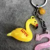 Yellow swan keychain pendant, fashionable letter S cartoon pendant Specification image