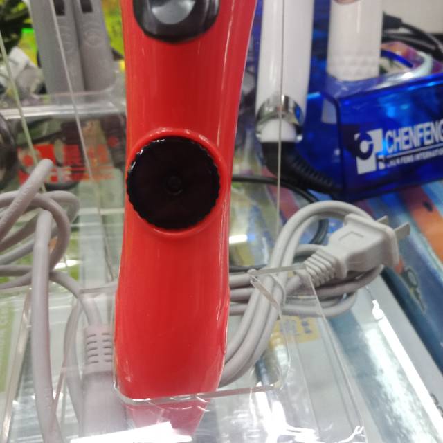 Straight bristle with a big red plug-in curling iron details Picture