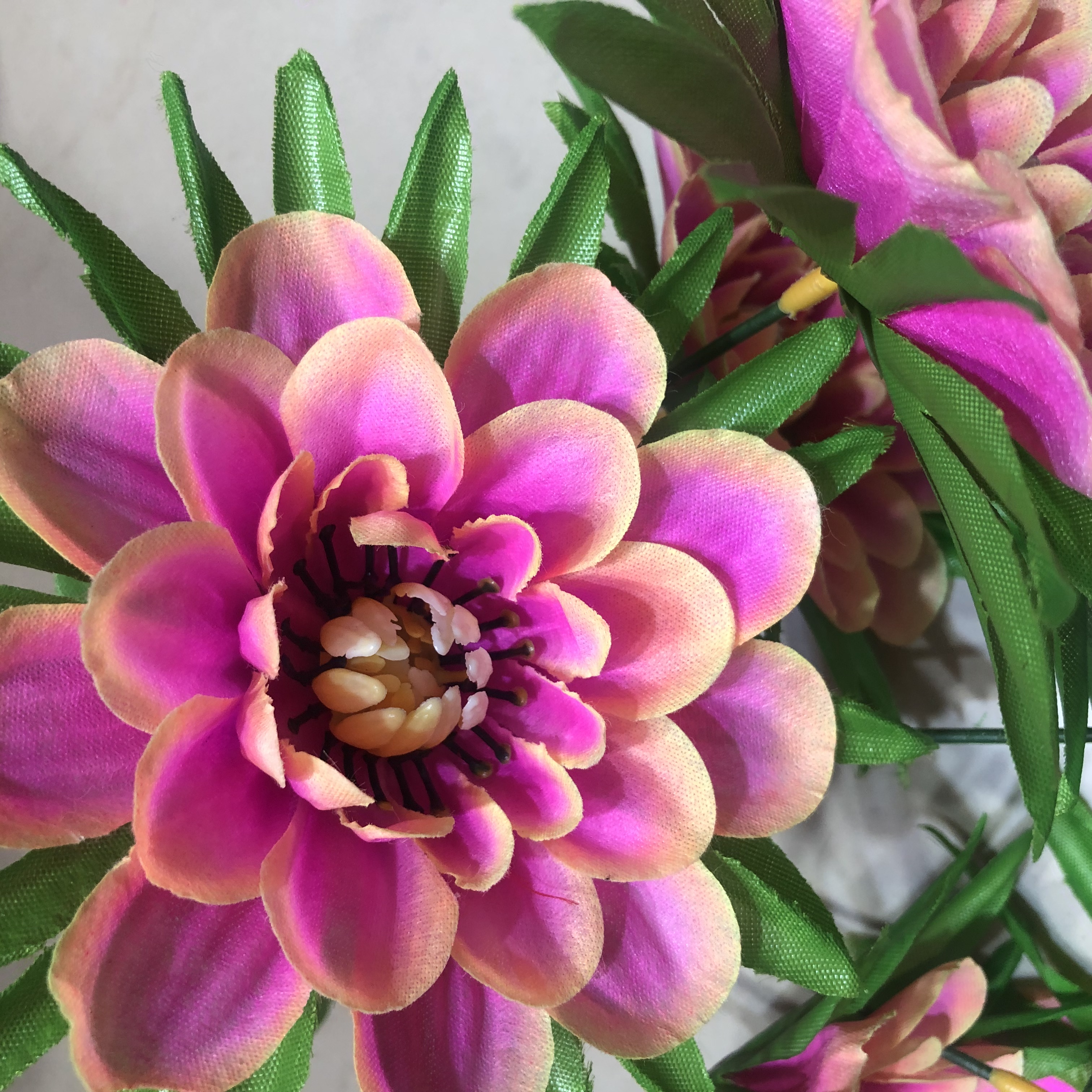 A single artificial floral arrangement, decorated with garden silk fabric, featuring plastic flower slots for chrysanthemums, black fungus chrysanthemums and orchids details Picture