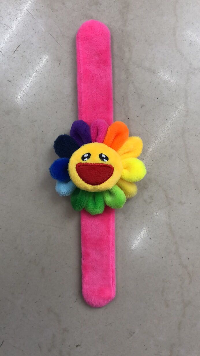 Takashi Murakami is wearing a stuffed alligator avocado cartoon bracelet thumbnail